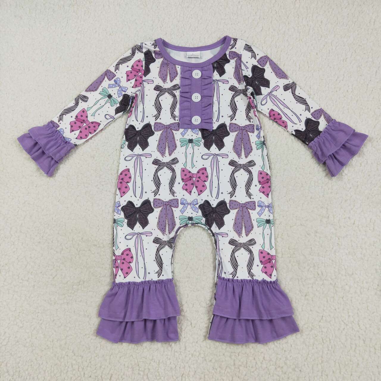 Purple bow ruffle romper
